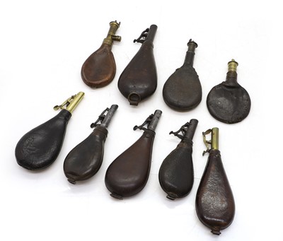 Lot 218 - A collection of nine leather shot flasks