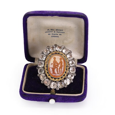 Lot 4 - A silver mounted black dot paste and carnelian intaglio brooch