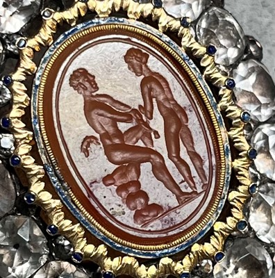 Lot 4 - A silver mounted black dot paste and carnelian intaglio brooch