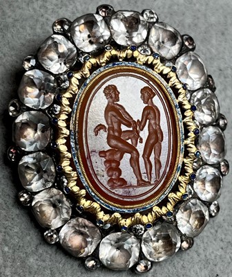 Lot 4 - A silver mounted black dot paste and carnelian intaglio brooch
