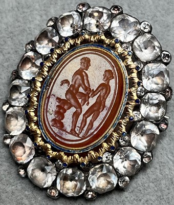 Lot 4 - A silver mounted black dot paste and carnelian intaglio brooch