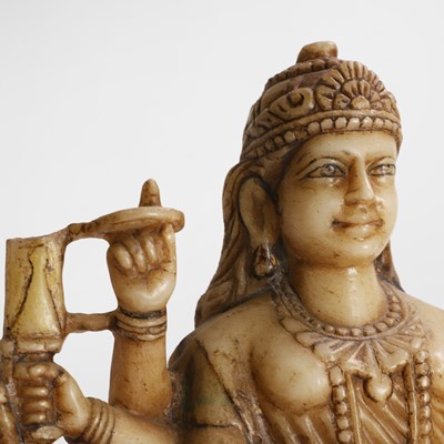 Lot 142 - An alabaster carved figure of Durga