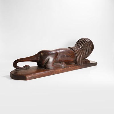 Lot 148 - A carved hardwood lion