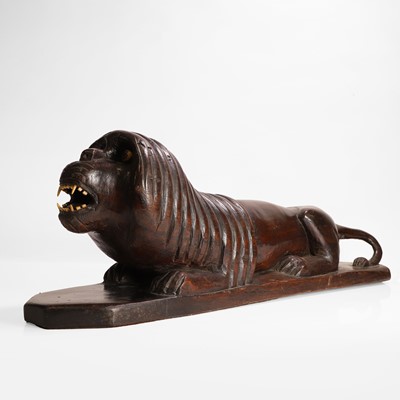 Lot 148 - A carved hardwood lion
