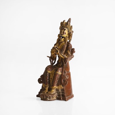 Lot 247 - A parcel-gilt bronze figure of a bodhisattva