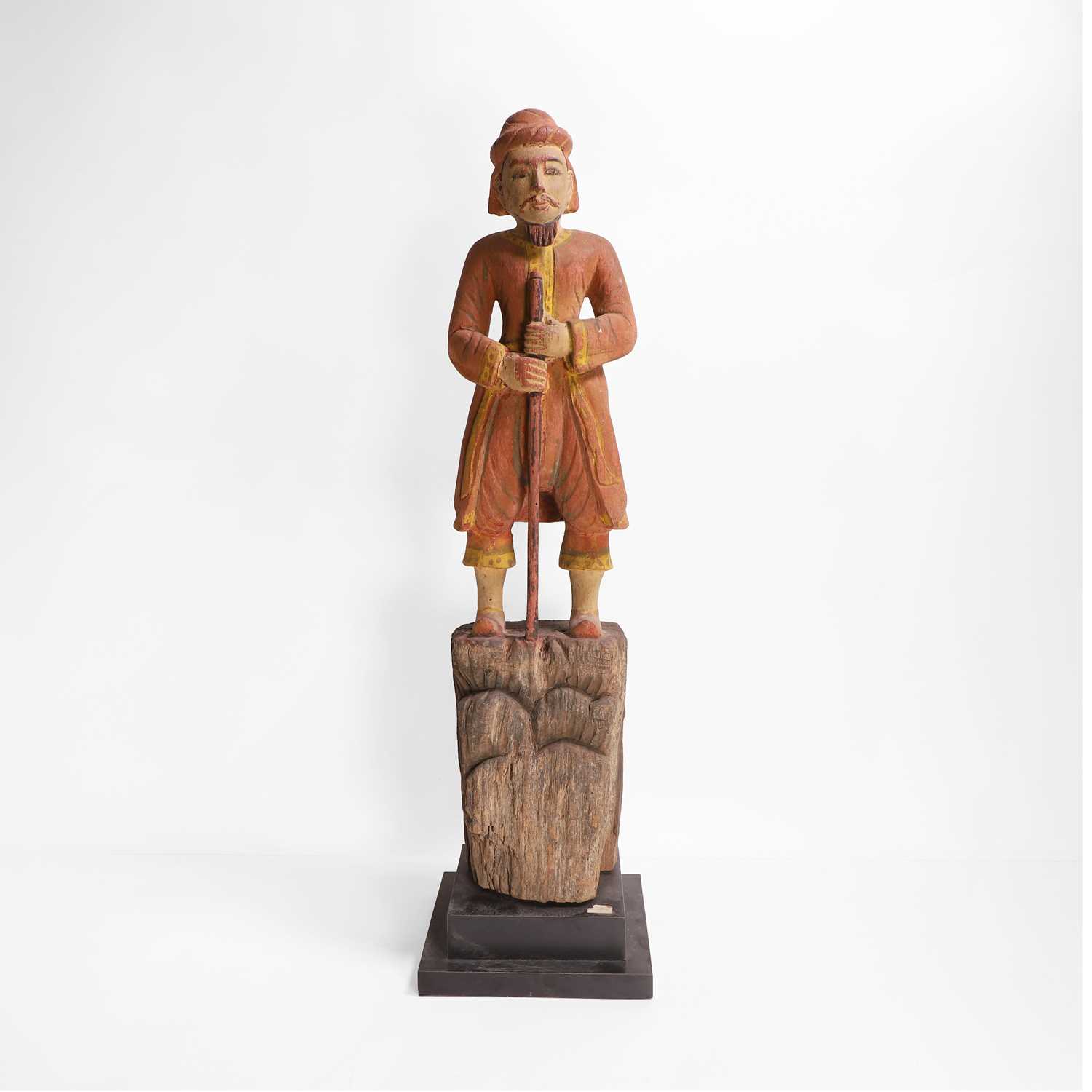 Lot 8 - A carved and polychrome-painted figure