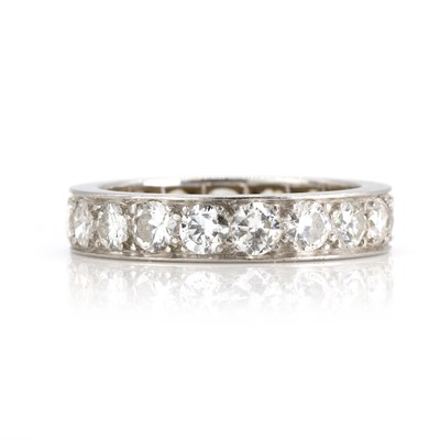 Lot 255 - A diamond full hoop eternity ring