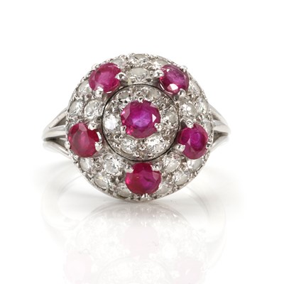 Lot 130 - A diamond and ruby bombé ring