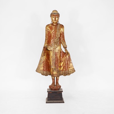 Lot 385 - A carved and lacquered standing Buddha