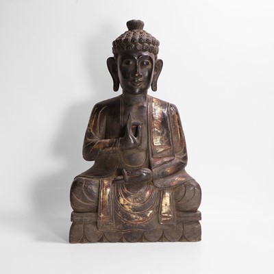 Lot 16 - A carved, gilt and polychrome-painted Buddha