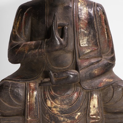Lot 16 - A carved, gilt and polychrome-painted Buddha
