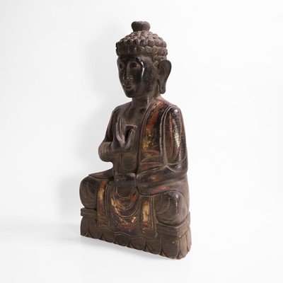Lot 16 - A carved, gilt and polychrome-painted Buddha