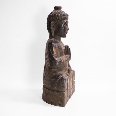 Lot 16 - A carved, gilt and polychrome-painted Buddha