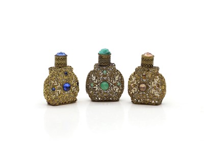 Lot 56 - Three Czechoslovakian gilt metal and mounted scent bottles
