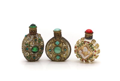 Lot 57 - Three Czechoslovakian gilt metal and mounted scent bottles