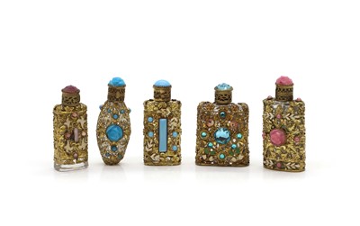 Lot 58 - Five Czechoslovakian gilt metal and mounted scent bottles