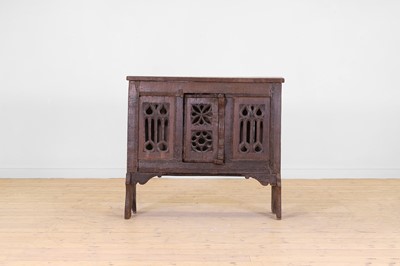 Lot 19 - A carved oak aumbry or food cupboard