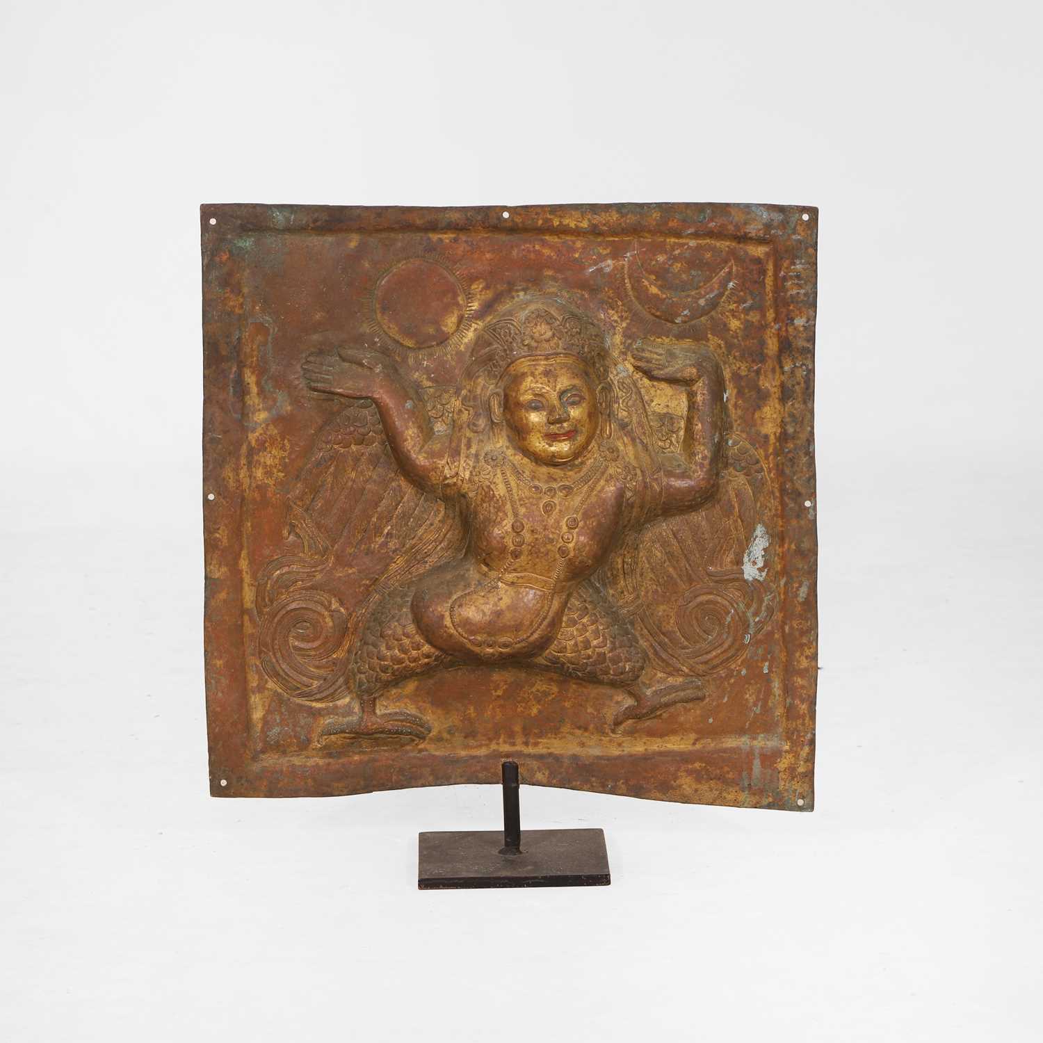 Lot 127 - A gilt-copper repoussé temple plaque