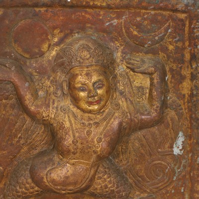 Lot 127 - A gilt-copper repoussé temple plaque