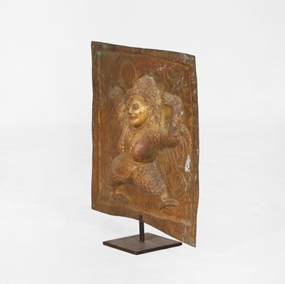 Lot 127 - A gilt-copper repoussé temple plaque