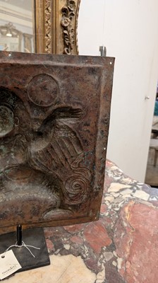 Lot 127 - A gilt-copper repoussé temple plaque