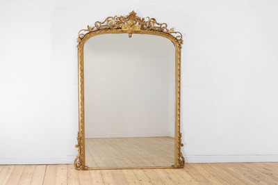 Lot 599 - A large carved giltwood and gesso overmantel mirror