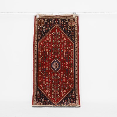 Lot 185 - A wool rug