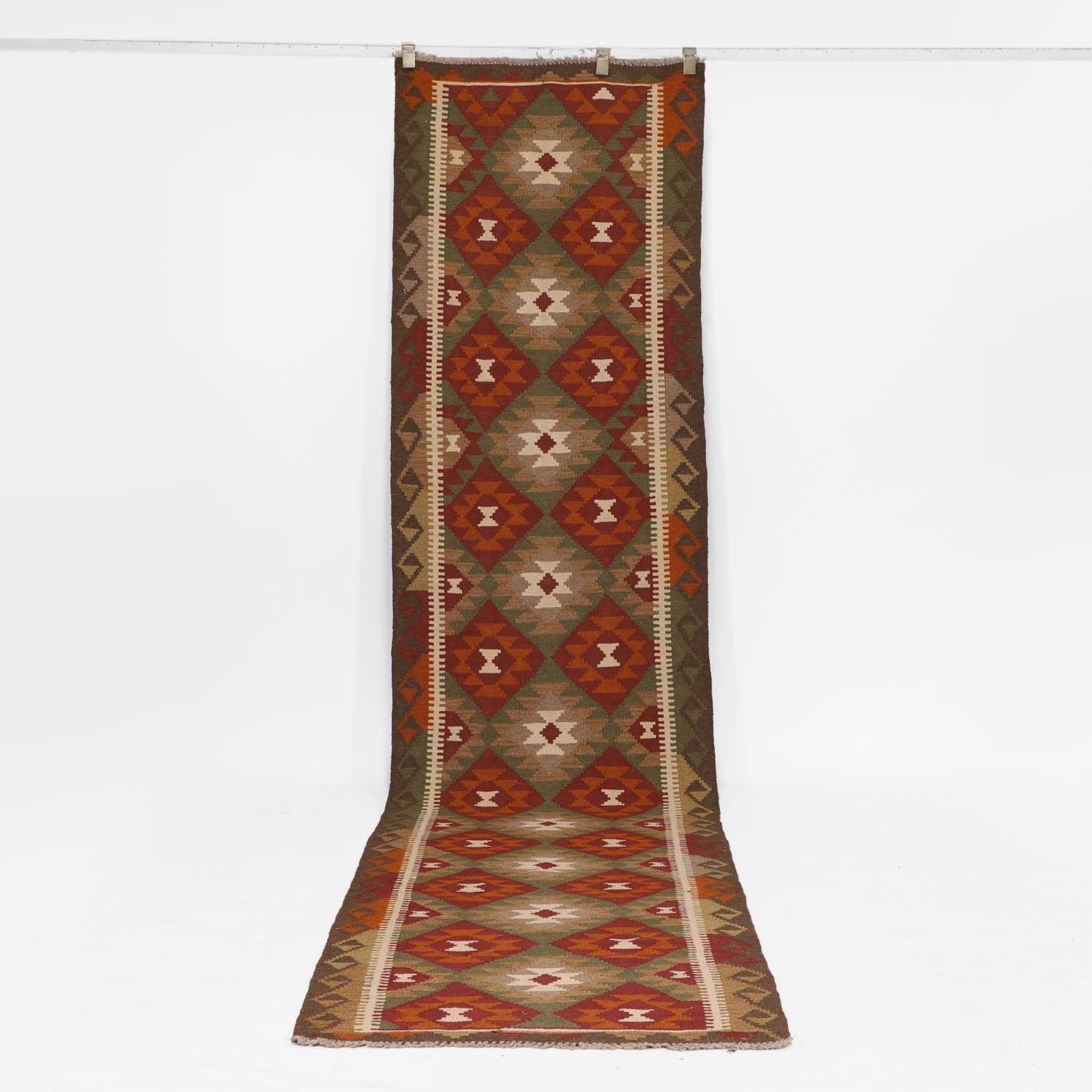 Lot 9 - A kilim runner