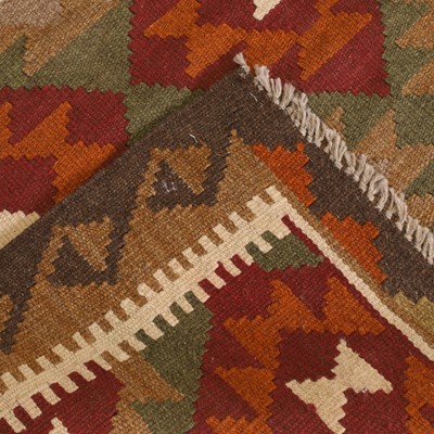 Lot 9 - A kilim runner