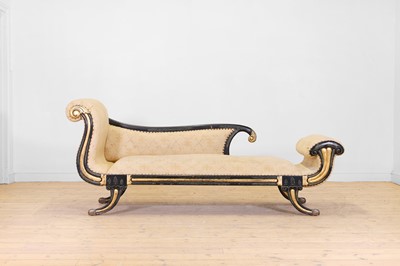 Lot 101 - A Regency-style ebonised and parcel-gilt chaise longue