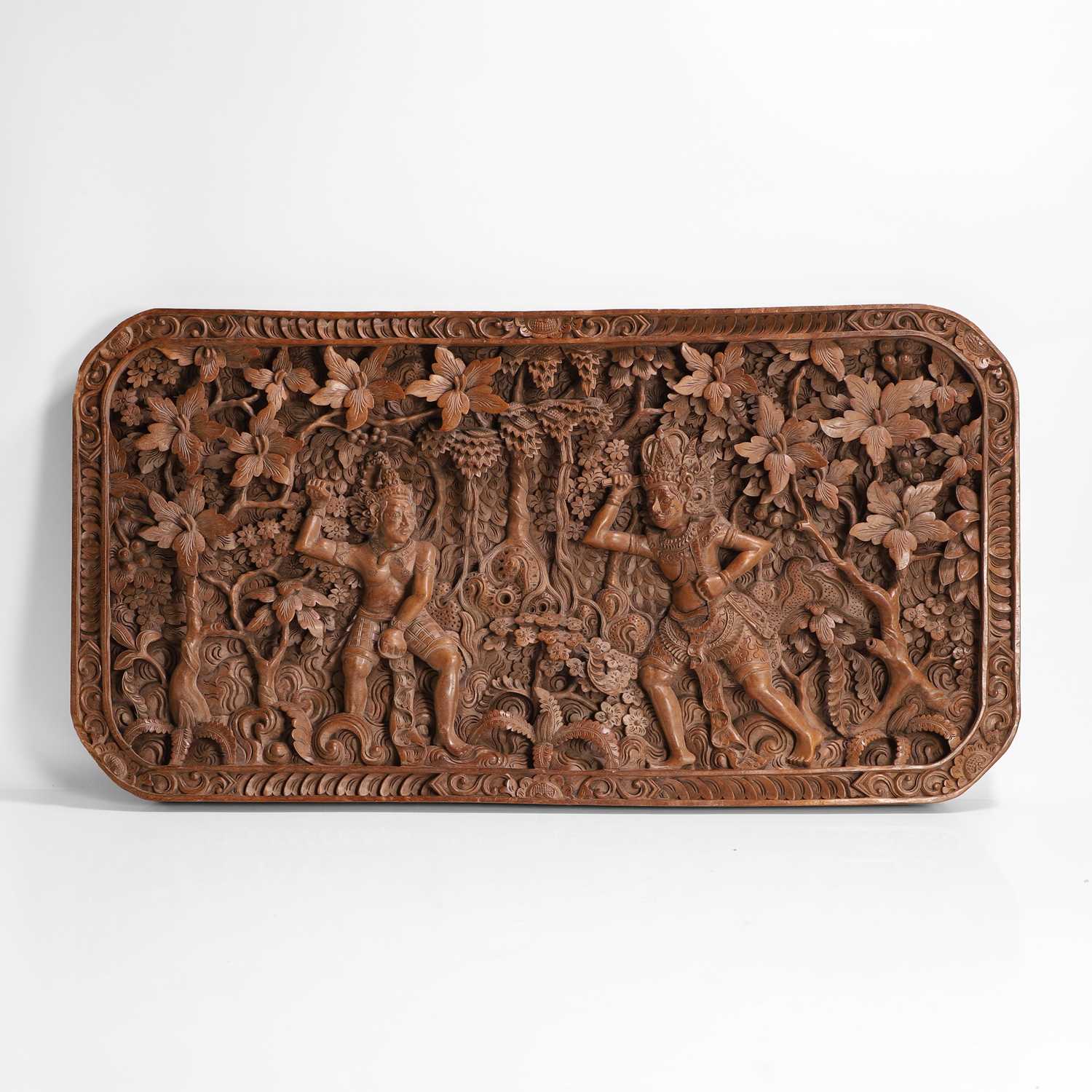Lot 141 - A carved teak panel