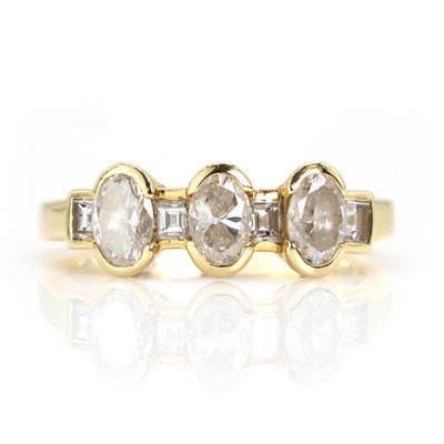 Lot 143 - An 18ct gold diamond three stone ring