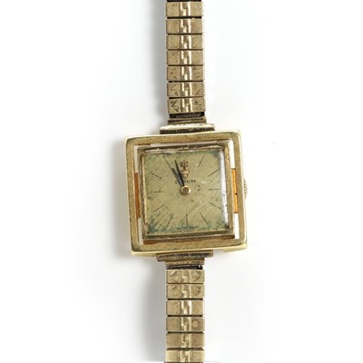 Lot 423 - A ladies' 18ct gold Corum mechanical bracelet watch