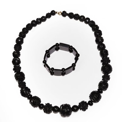 Lot 30 - A Victorian carved Whitby jet bead necklace and a bracelet