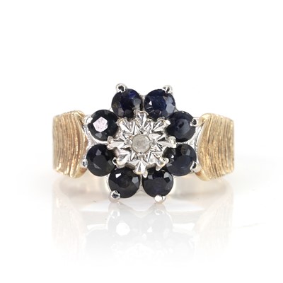 Lot 110 - A 9ct gold sapphire and diamond cluster ring