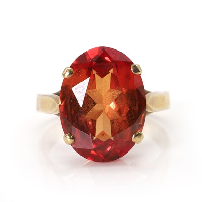 Lot 40 - A synthetic orange sapphire ring