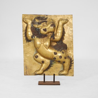Lot 166 - A gilt-copper panel of a lion