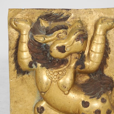 Lot 166 - A gilt-copper panel of a lion