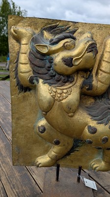 Lot 166 - A gilt-copper panel of a lion