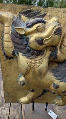 Lot 166 - A gilt-copper panel of a lion