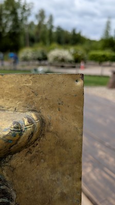 Lot 166 - A gilt-copper panel of a lion