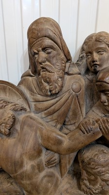 Lot 165 - A large carved walnut relief