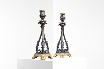 Lot 515 - A pair of Regency patinated and gilt-bronze candlesticks