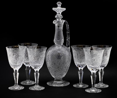 Lot 334 - A Stevens and William intaglio cut set of six wine glasses and a claret jug and stopper