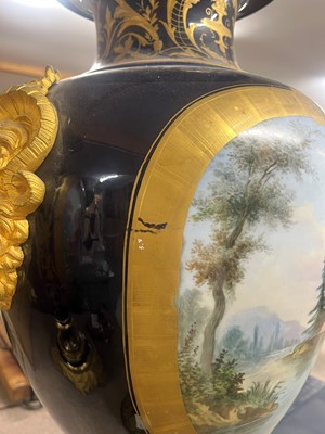 Lot 391 - A pair of large Sèvres-style porcelain vases and covers