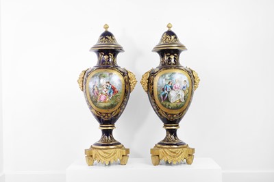 Lot 391 - A pair of large Sèvres-style porcelain vases and covers