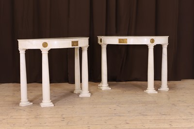 Lot 120 - A pair of white marble demilune console tables