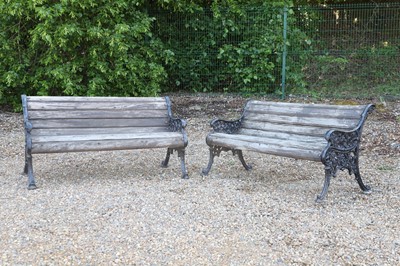 Lot 475 - A pair of cast iron and teak garden benches