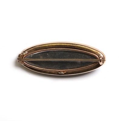 Lot 8 - A Victorian onyx, diamond and split pearl mourning brooch