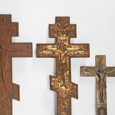 Lot 33 - A group of four brass crucifixes